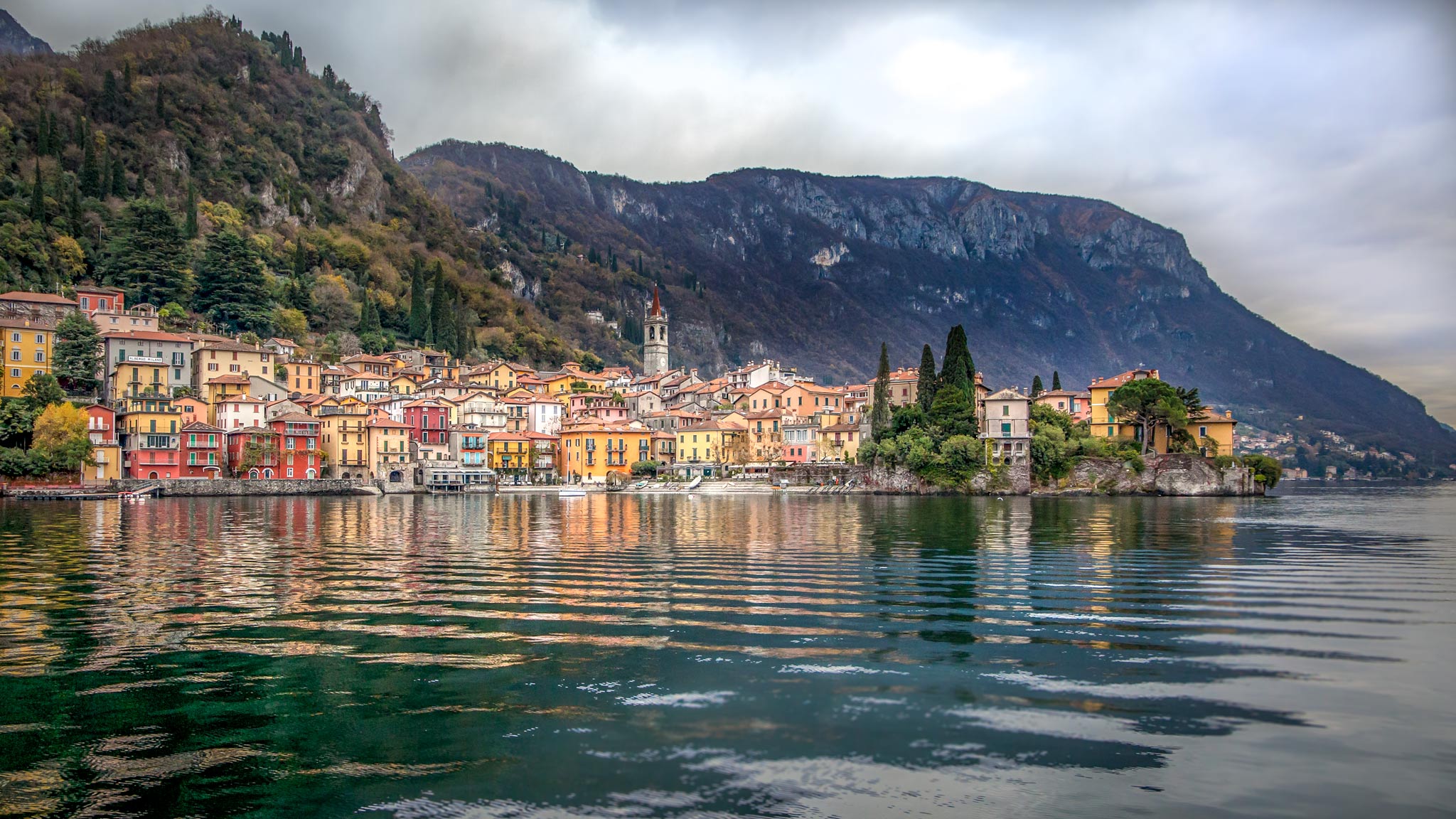 Lake Como in Lombardy with the colourful village reflecting in the ocean