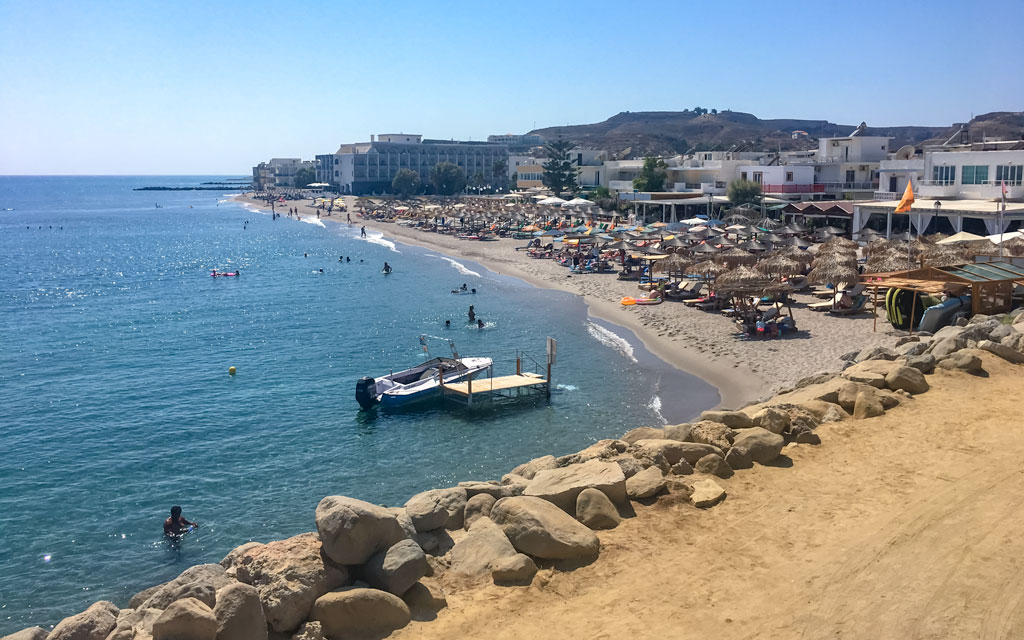 Kardamaina Kos beach with low level resorts behind 