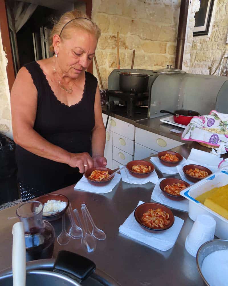 Making pasta outside a small house in Bari