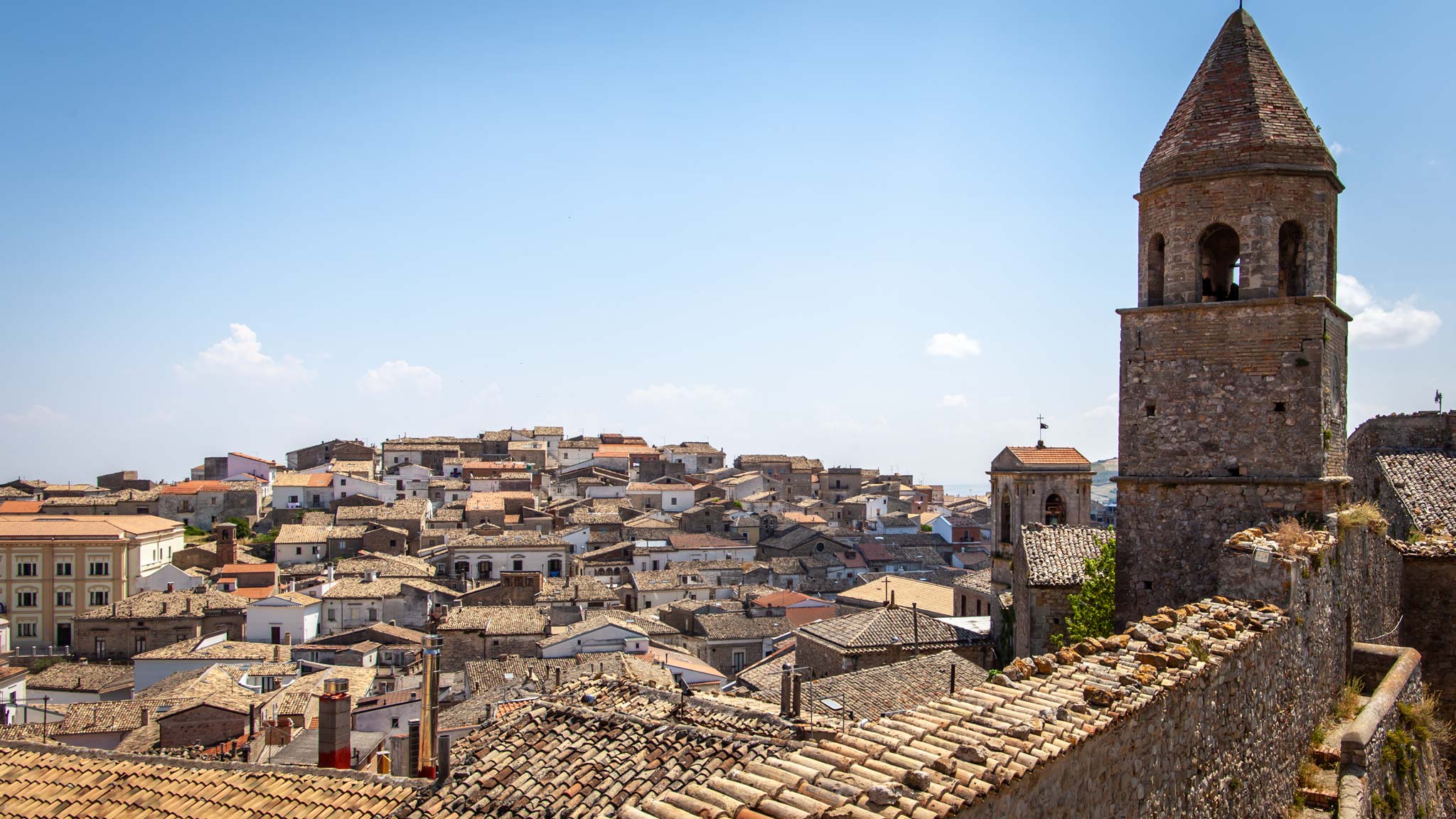 Rooftops of an Puglian town with a church tower in the foreground