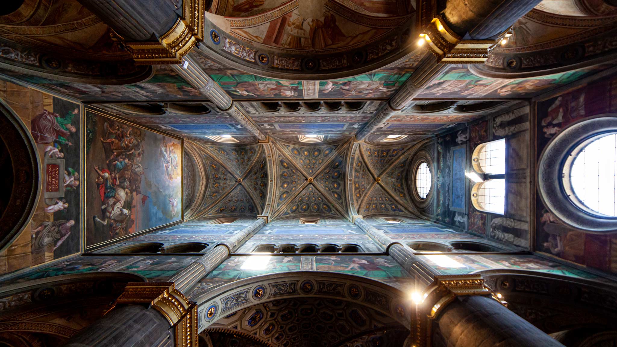 Looking up at the frescoes on the ceiling of Cremona Cathedral