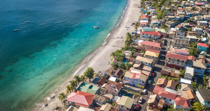 Aerial view of St Josephs on Dominicas west coast with a small town alongside it