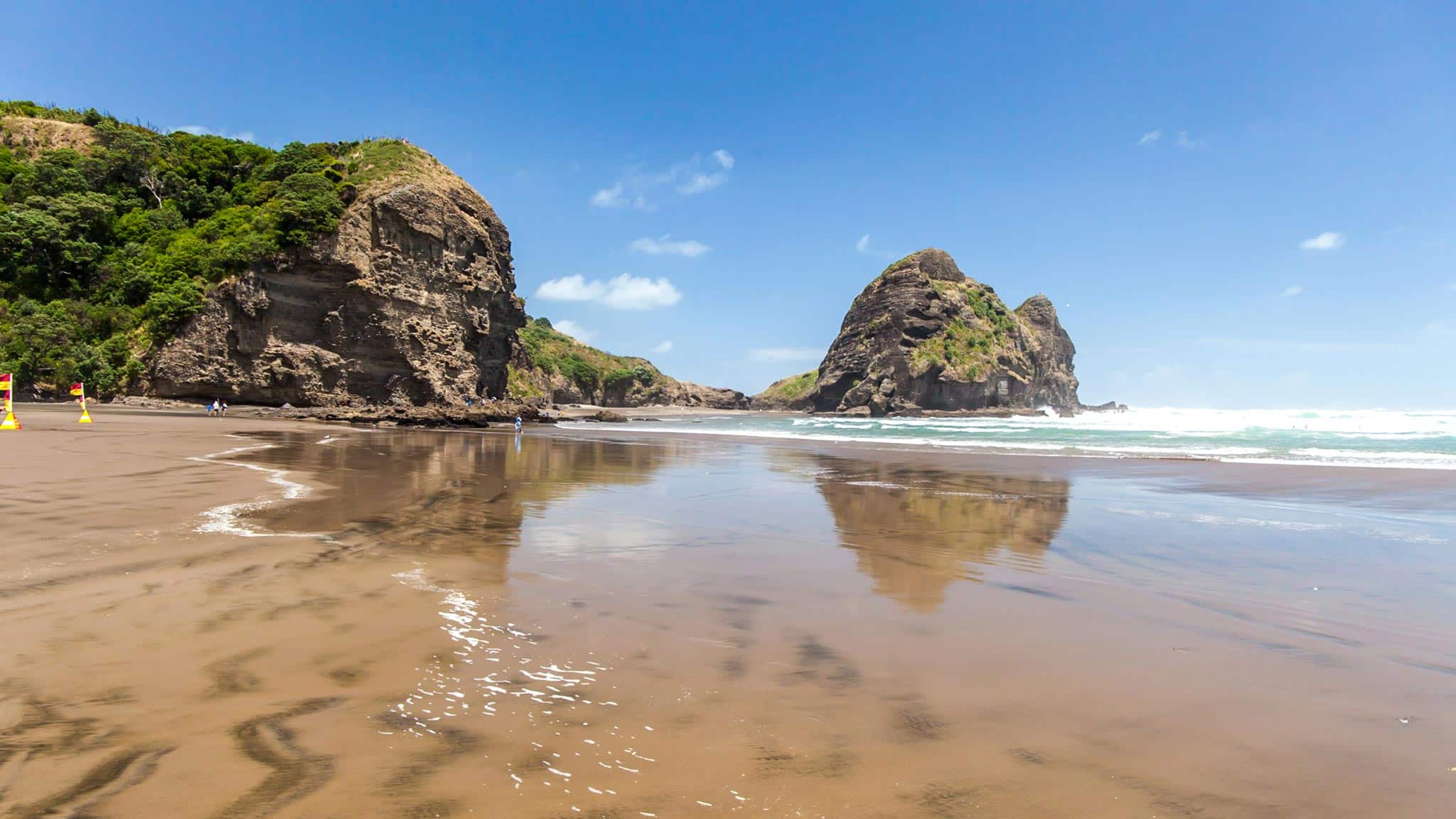 Piha beach reflections in the water