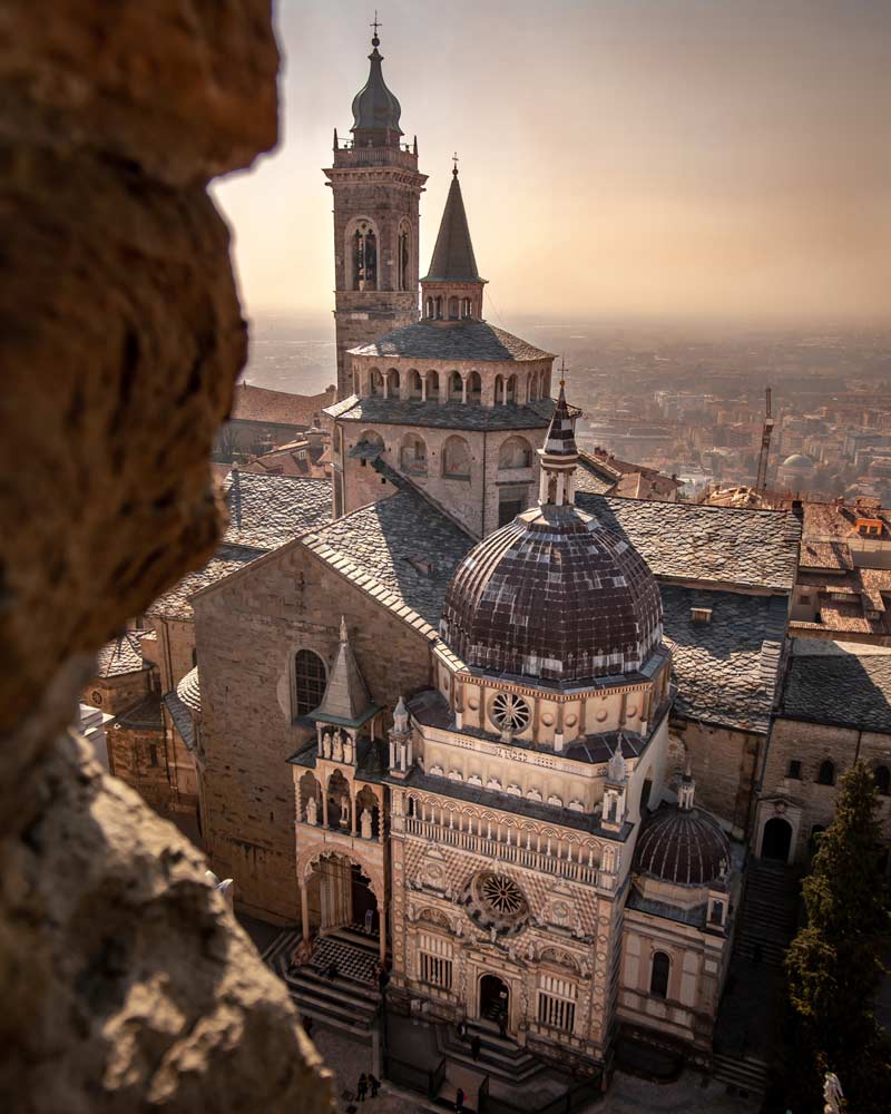 lombardy italy tourism The cathedral of Bergamo at sunset, as seen from a high up viewing platform