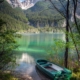 A boat sits by the edge of Lake Tovel in Trentino