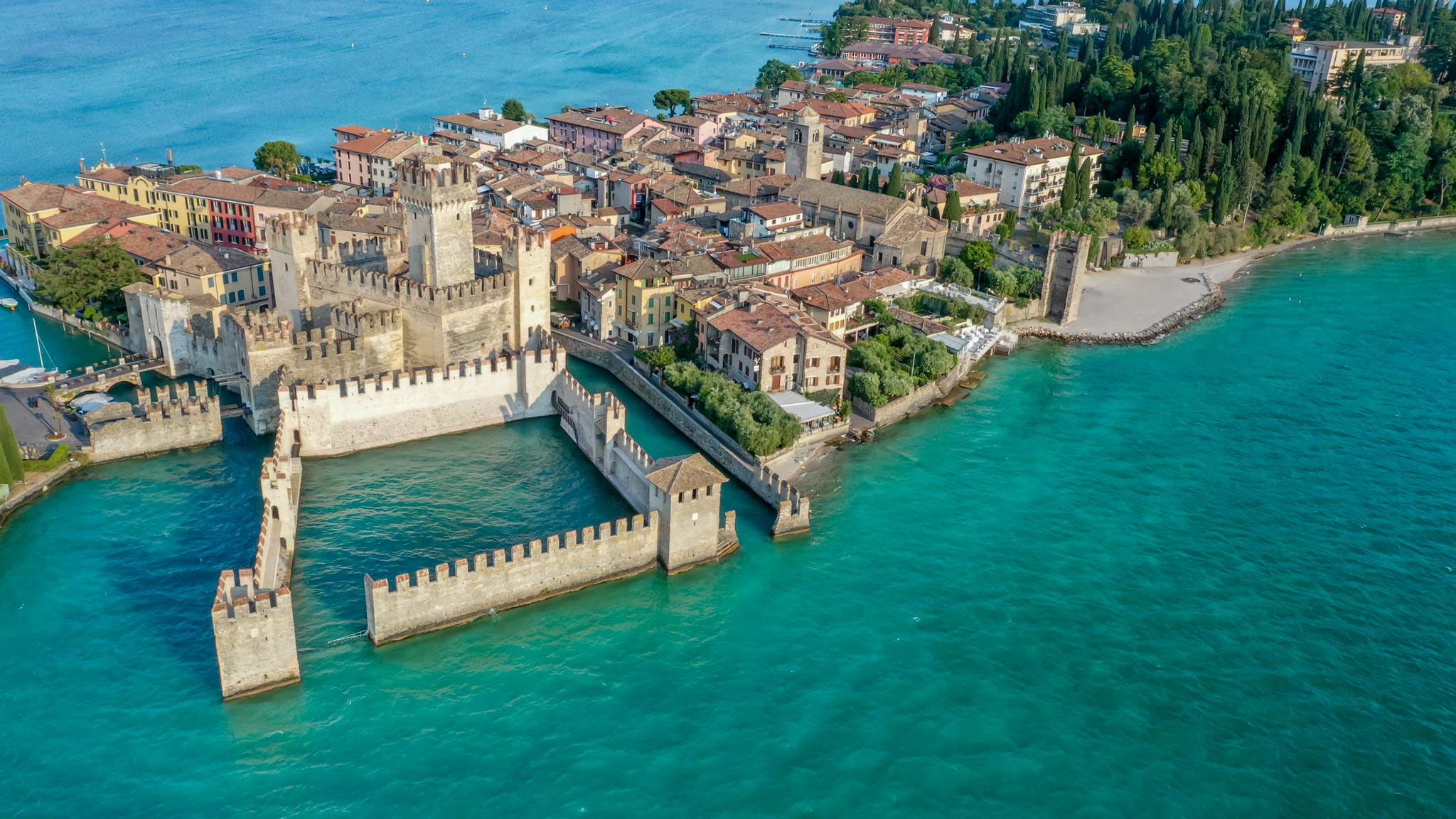 lombardy italy tourism The castle of Sirmione as seen from above with the island behind it