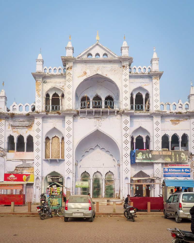 A popular white building with various windows and pillars in Lucknow India