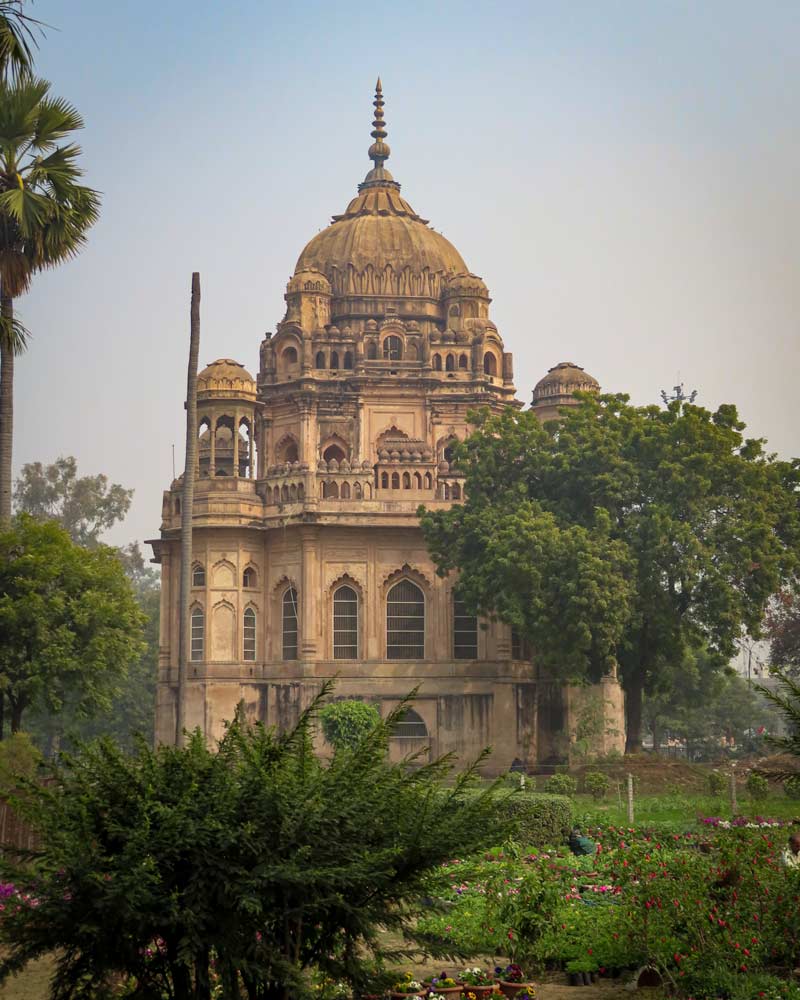 Hidden amongst trees and planets is a well preserved old religious building in Lucknow India