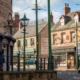 A street in Beamish Museum, with old fashioned shops and tram rails