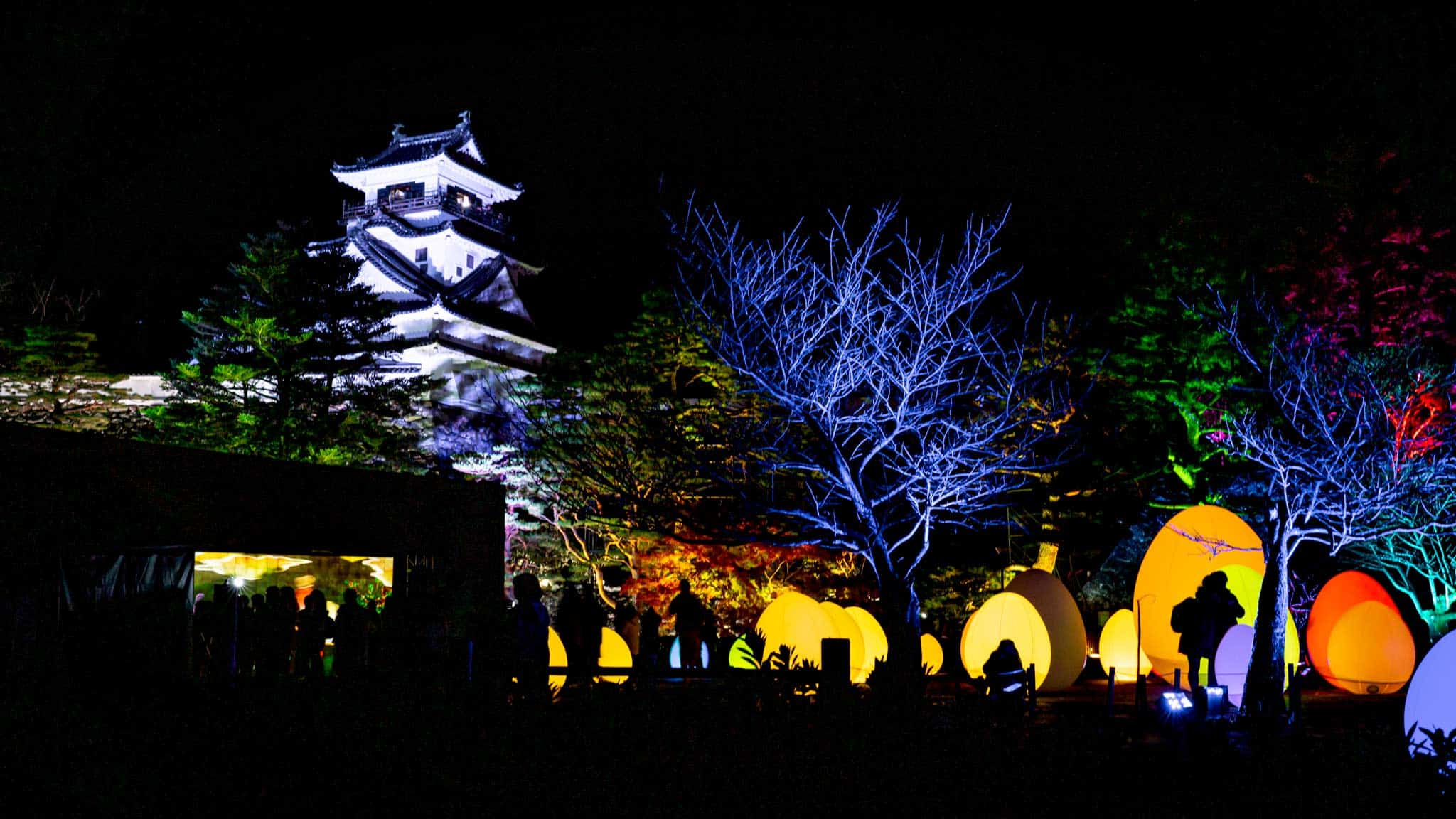 Kōchi Castle shines high above the coloured teamLab work