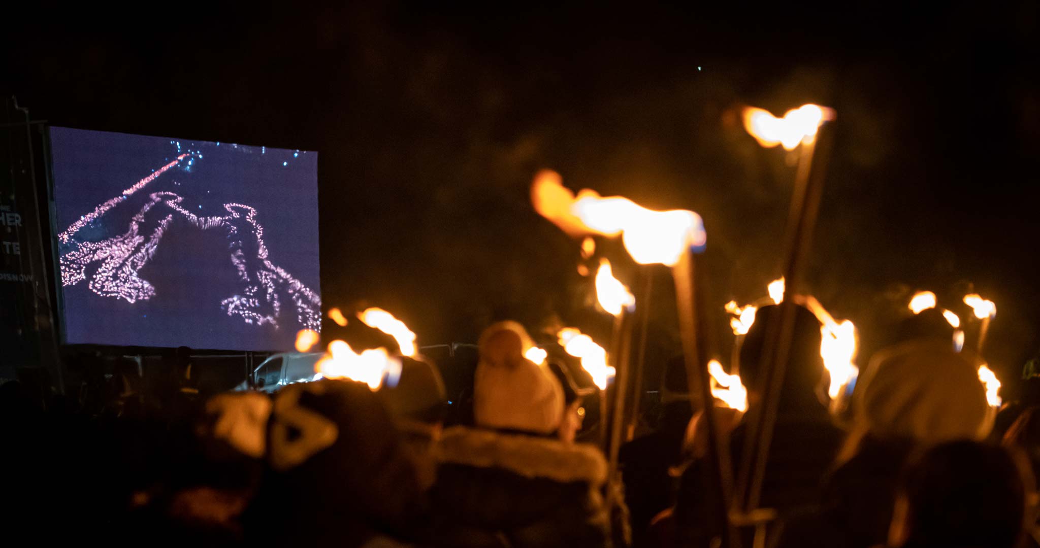 The crowds gather in Holyrood Park to create the image from above