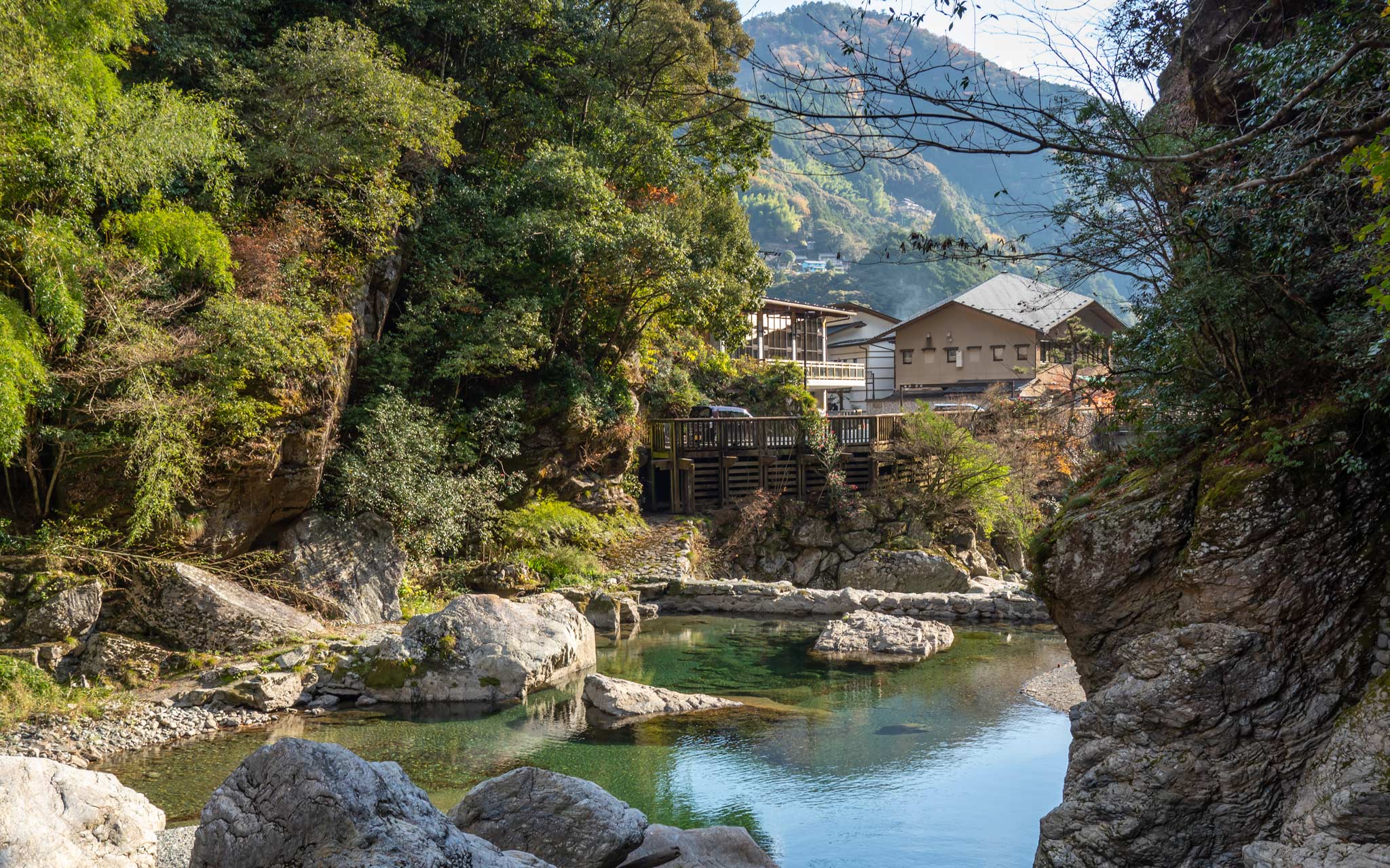 The beautiful waters of Nakatsu Valley with a traditional hotel in the background