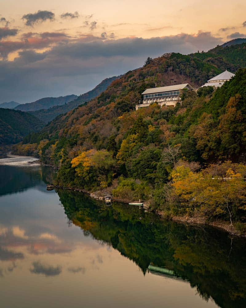 A sunset reflection shot of the Siera Shimanto Hotel in the river