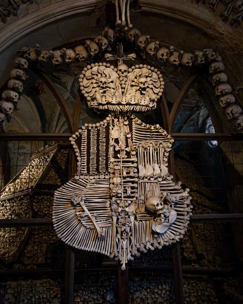 A coat of arms made of bones in the Bone Chapel of Kutna Hora