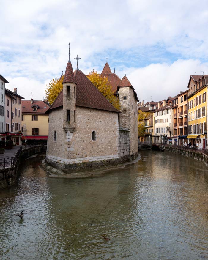 Annecy, France – a small castle-like building raises from the waters