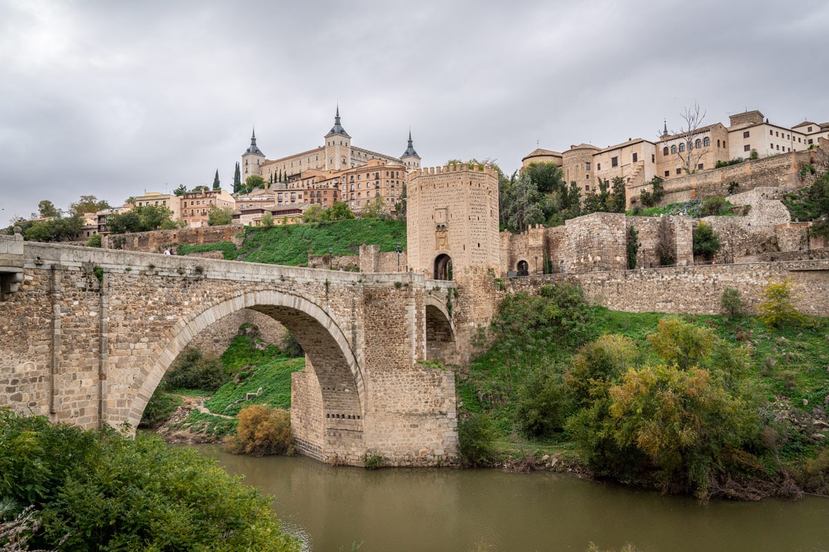 View of Toledo's Puente de Alcántara and above, the Alcázar