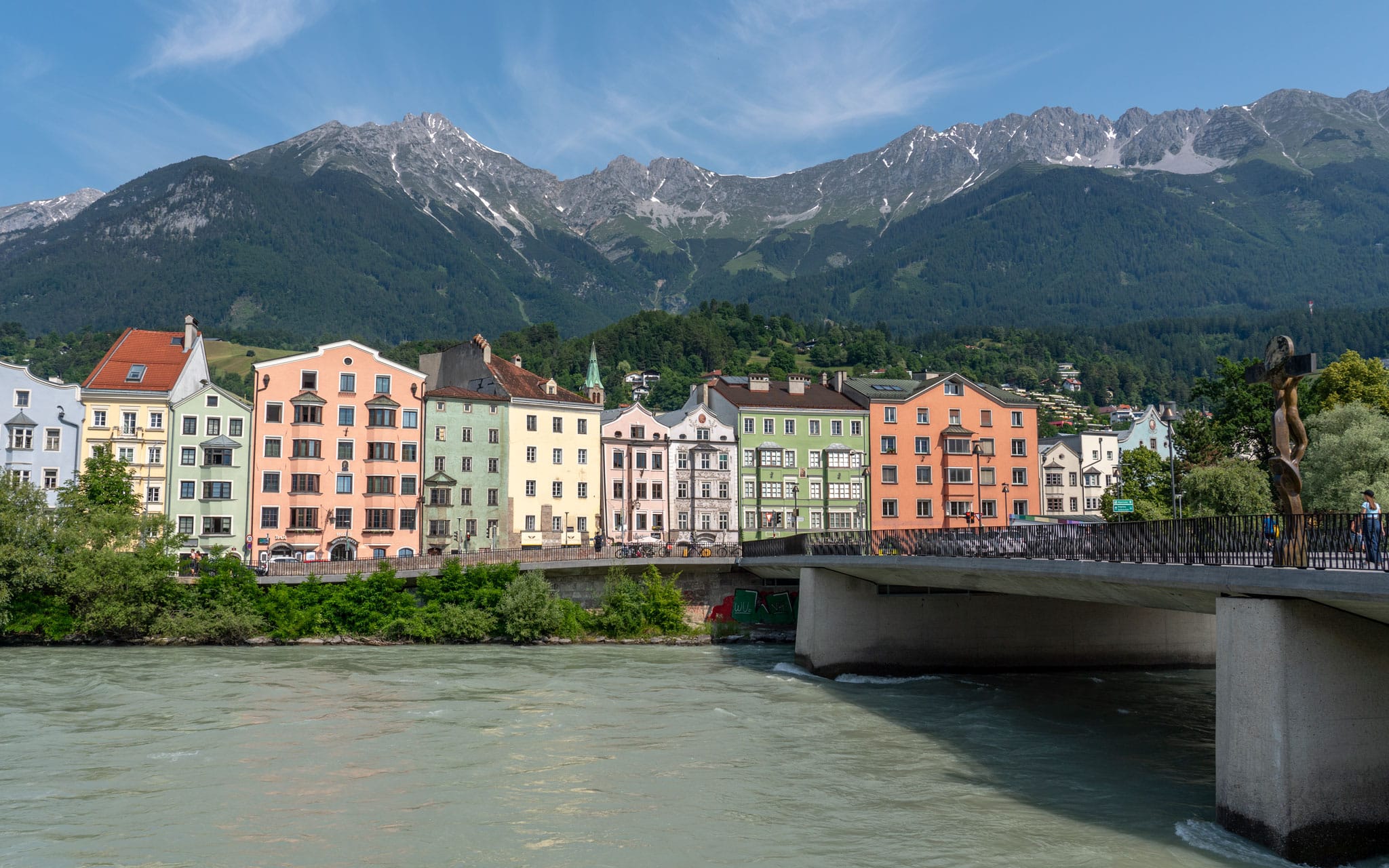 Colourful houses by the river during summer in Innsbruck