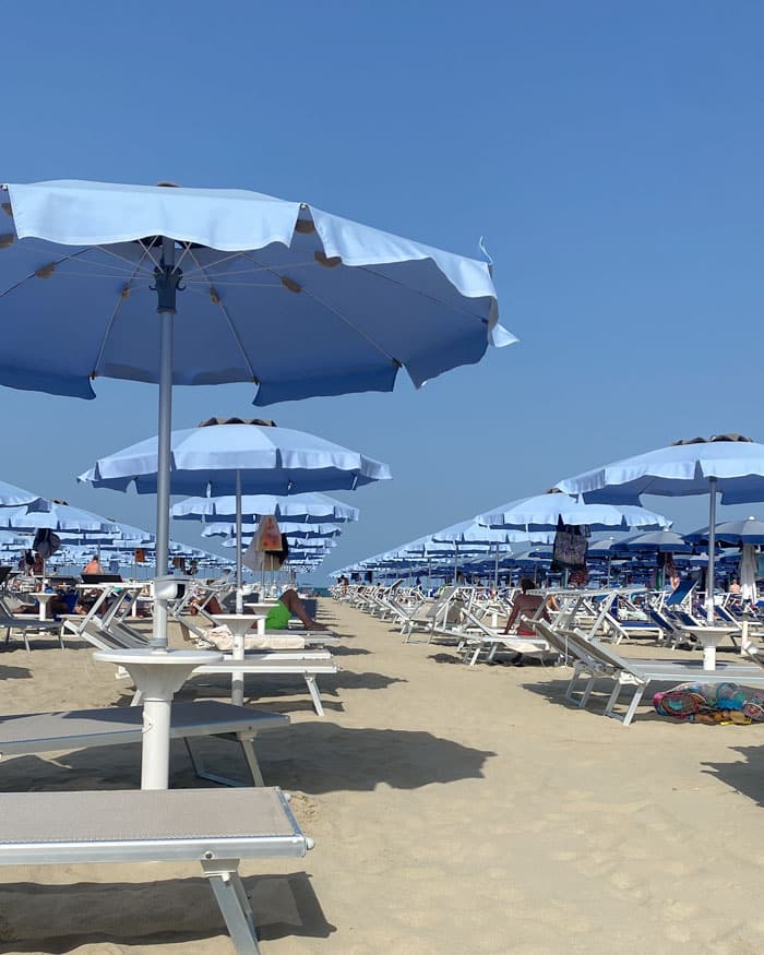 Umbrellas flutter with the Adriatic breeze
