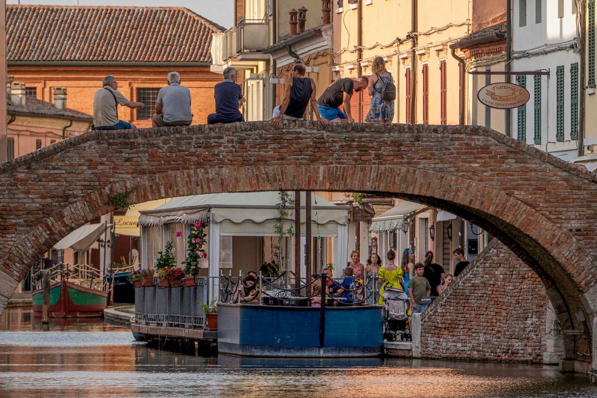 Sunset in Comacchio, with aperitivo hour on a boat restaurant