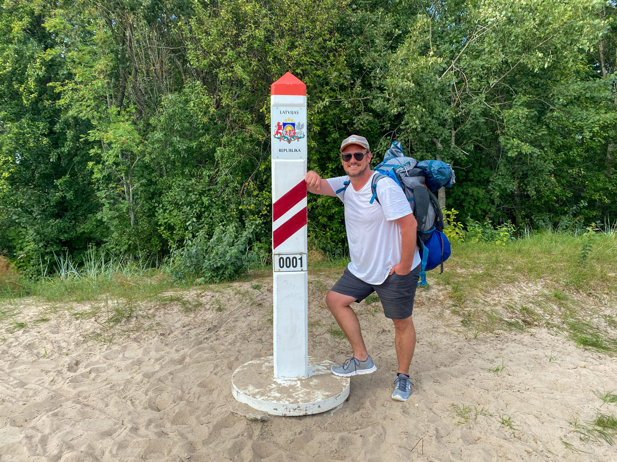 Crossing the border between Lithuania and Latvia on the Baltic Coastal Trail