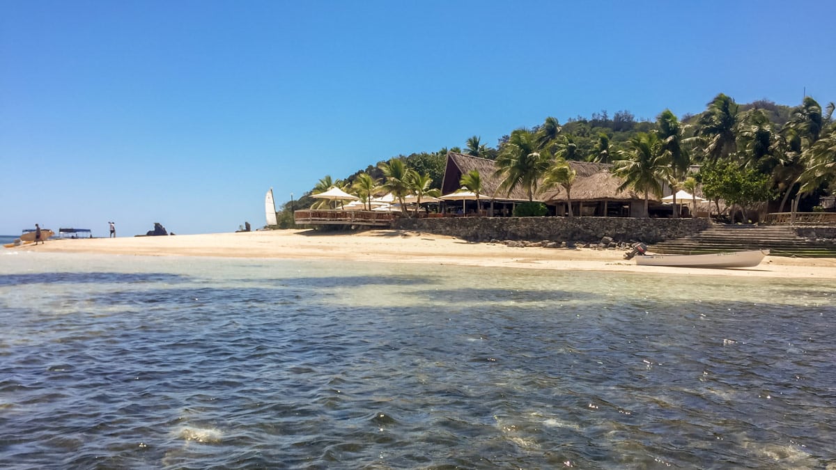 Wading across the waters to Castaway Island after jumping off the fishing boat