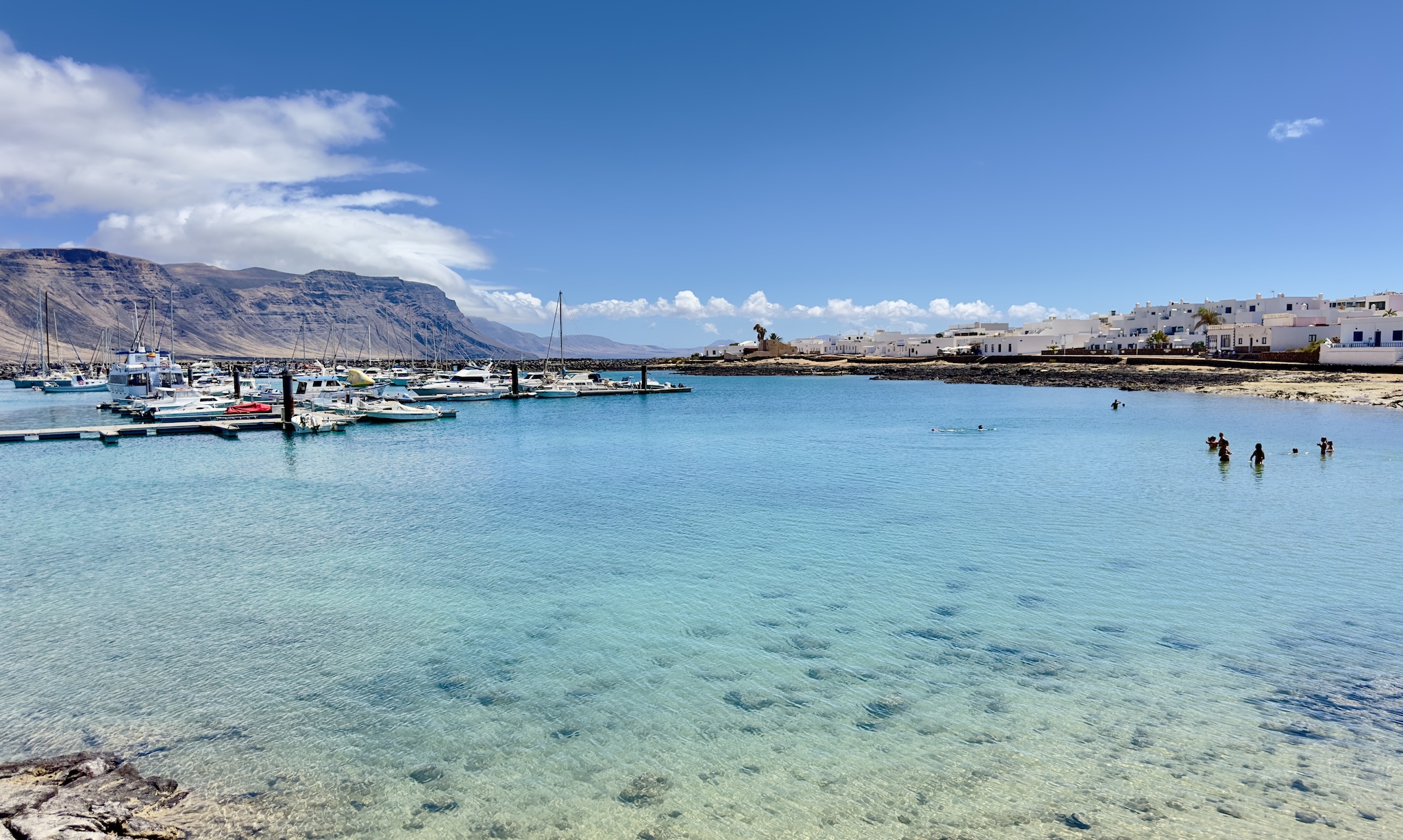 At Caleta de Sebo, on La Graciosa, swim with views of Lanzarote