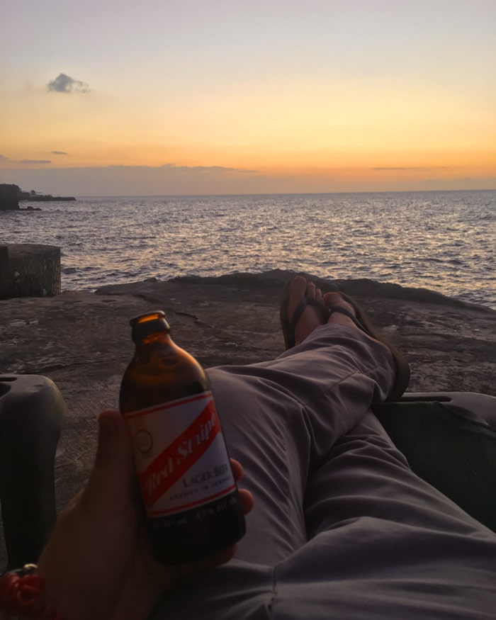 Drinking a Red Strip at sunset